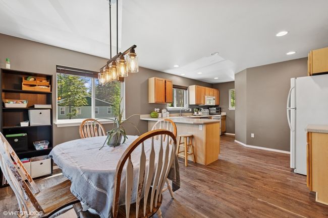 Dining space featuring wood finished floors, baseboards, and recessed lighting | Image 5