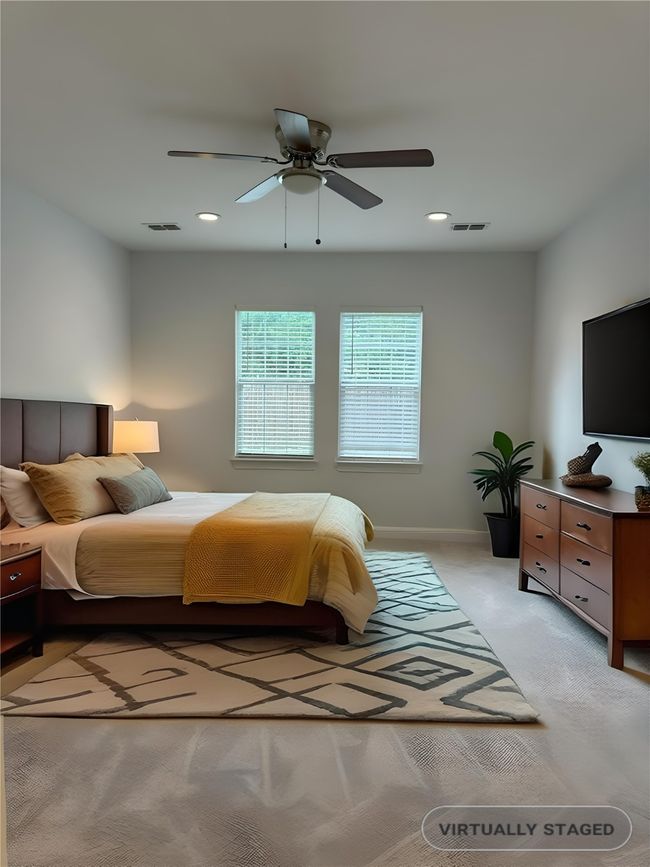 Staged Bedroom featuring recessed lighting, a ceiling fan, and light carpet | Image 15
