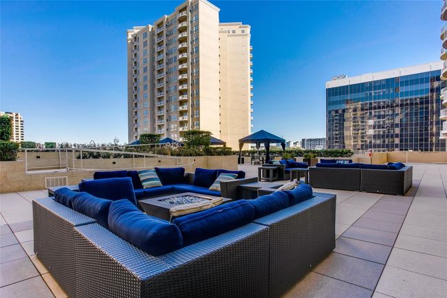 View of patio / terrace featuring an outdoor living space with a fire pit and a city view | Image 8