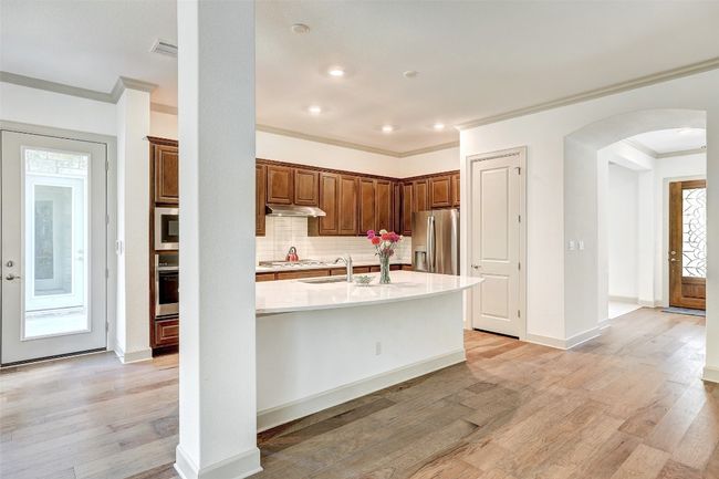 Door to Garage, Kitchen and front door view | Image 20