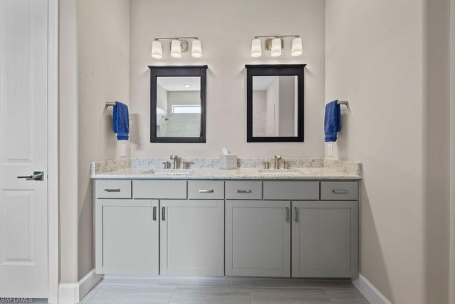 Full bath with a sink, baseboards, and double vanity | Image 24
