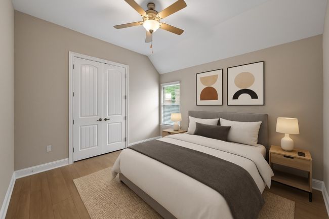 Bedroom featuring a closet, wood finished floors, lofted ceiling, and a ceiling fan | Image 26