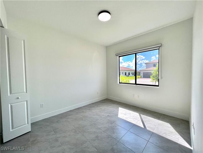View of tiled spare room | Image 22