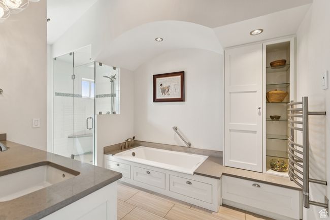 Bathroom featuring a garden tub, a stall shower, vanity, and recessed lighting | Image 19