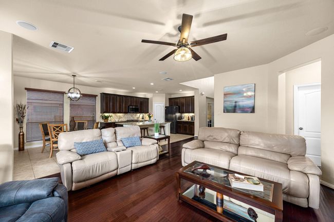 View from the fireplace showing off the open concept of the living areas. | Image 14