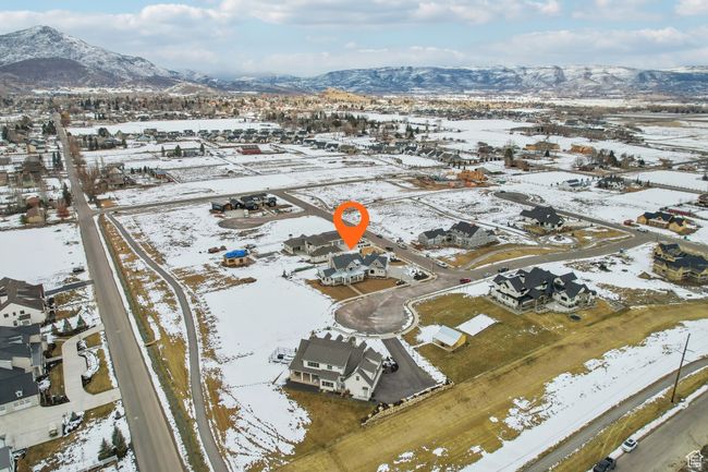Snowy aerial view featuring a residential view and a mountain view | Image 60
