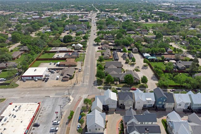 Aerial view to the east on 18th St. Shows DART rail line crossing (2 blocks away) and Plano Municipal Center (upper right corner) | Image 35