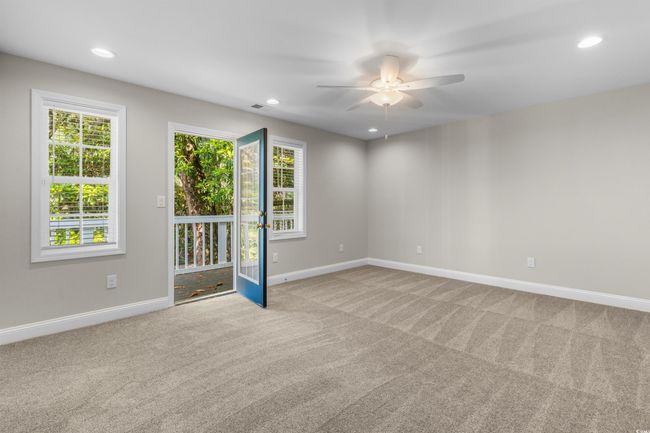 Unfurnished room with a ceiling fan, carpet floors, baseboards, healthy amount of natural light, and recessed lighting | Image 23