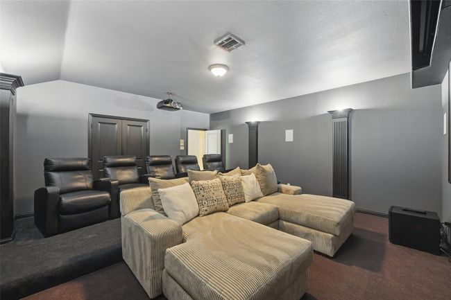 Home theatre offers plenty of seating opportunities with raised area in the back. | Image 27