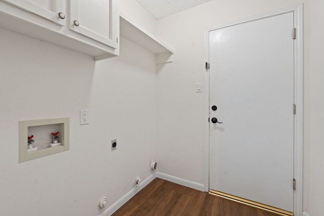 There is also an in home laundry rom at the garage entry. | Image 30