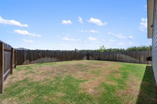 View of fenced backyard | Image 31