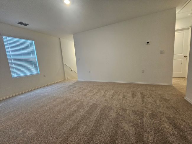 Carpeted spare room with baseboards and visible vents | Image 20