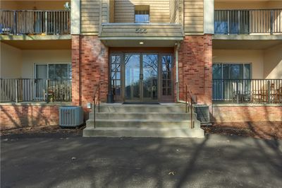 Welcome to 555 Sloop Rd Unit 12! A beautifully remodeled and updated condo with, stainless appliances, granite counter tops, stylish cabinetry and new wood flooring through out! This apartment has a fantastic rear patio with views of the woods and an occasional deer! Welcome to your next home! | Image 1