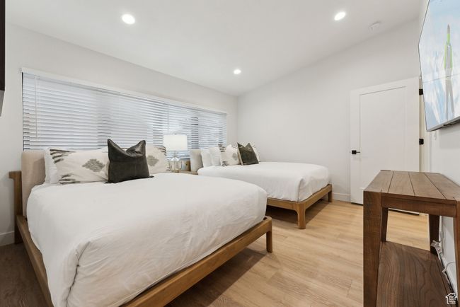 Bedroom featuring lofted ceiling and light hardwood / wood-style flooring | Image 29