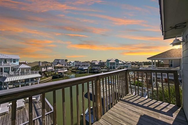 Enjoy serene canal views from the private upper deck of the primary suite. | Image 21