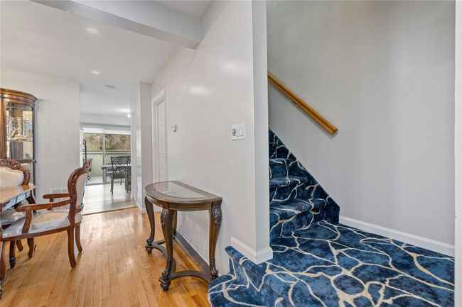 Stairs with hardwood / wood-style floors, baseboards, and recessed lighting | Image 21