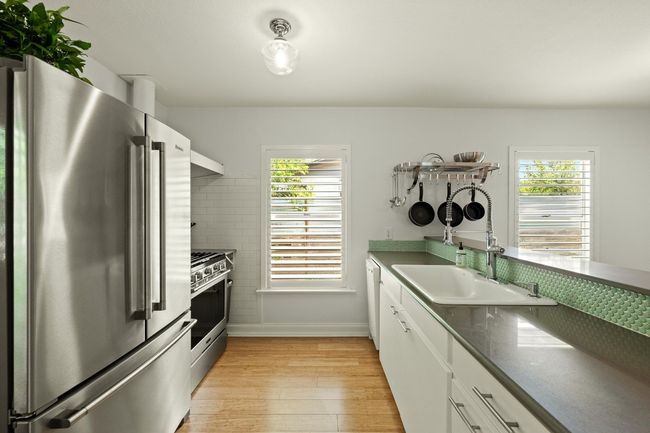 The kitchen offers a stainless steel oven and gas stove. | Image 10