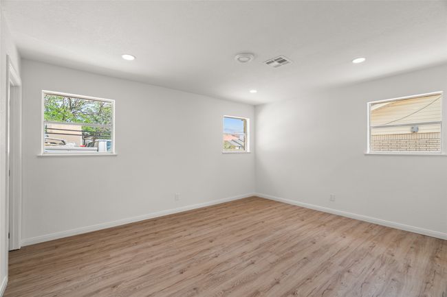 Unfurnished room with light wood-style flooring, plenty of natural light, baseboards, and recessed lighting | Image 13