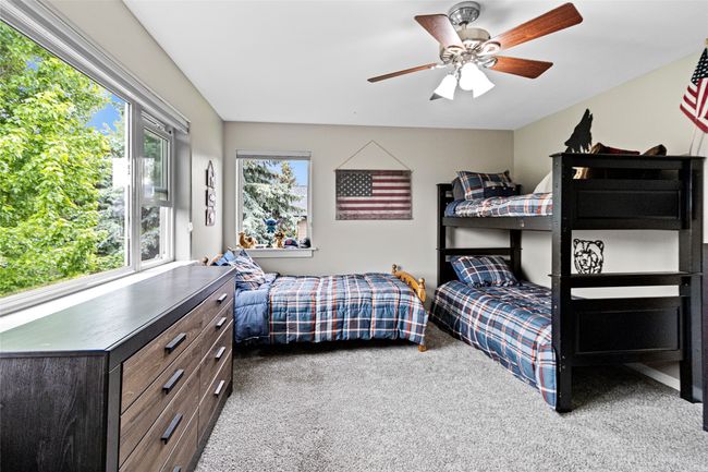 Bedroom featuring carpet and a ceiling fan | Image 52
