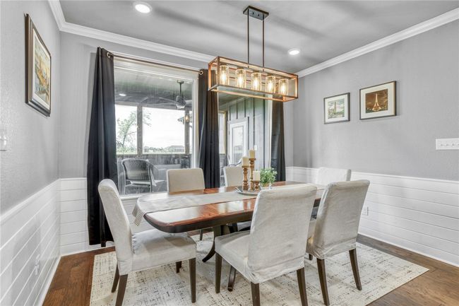 Dining space featuring crown molding and hardwood / wood-style flooring | Image 21