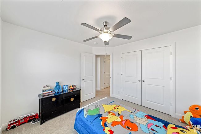 Bedroom featuring carpet floors, a closet, and a ceiling fan | Image 26