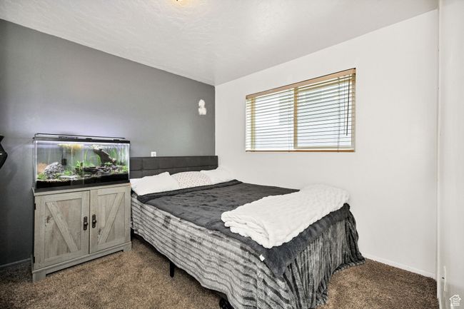 Carpeted bedroom featuring baseboards | Image 25