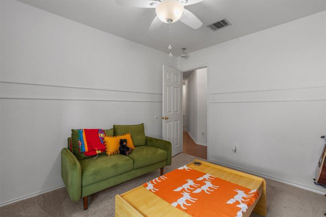 Living area featuring carpet and ceiling fan | Image 25