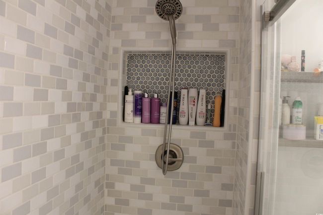 Bathroom featuring tiled shower | Image 12