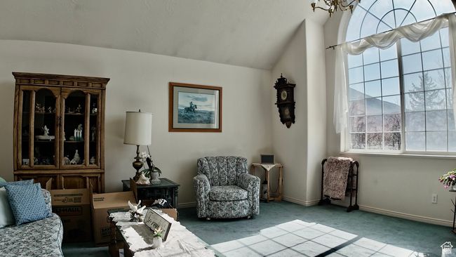 Living area with baseboards, carpet, and vaulted ceiling | Image 55