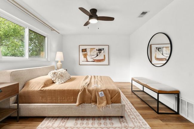 Bedroom featuring wood finished floors and a ceiling fan | Image 11