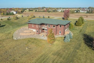 Expansive backyard with large patio and deck. | Image 3