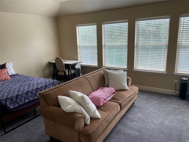 Guest bedroom/game room featuring carpet floors and multiple windows | Image 21