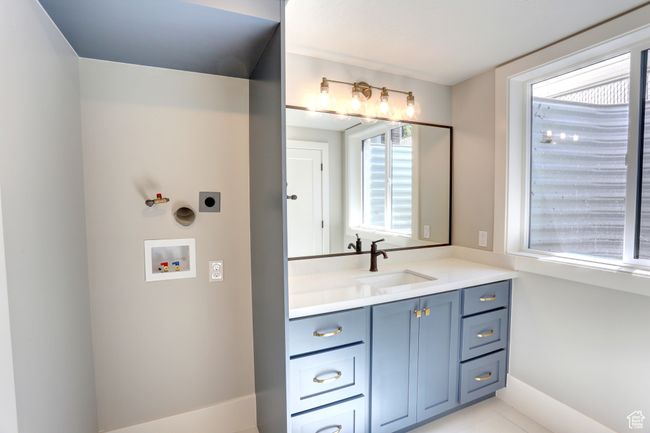 Bathroom with vanity and tile patterned floors | Image 37