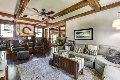 Living room featuring coffered ceiling, a healthy amount of sunlight, ceiling fan, and hardwood / wood-style floors | Image 3