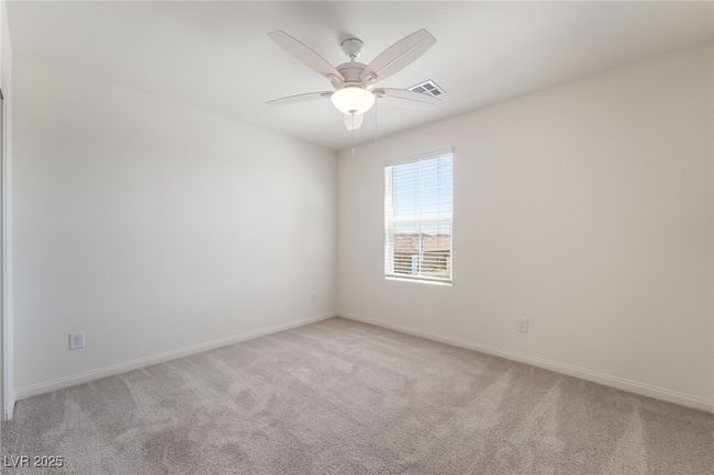 Unfurnished room featuring light carpet and a ceiling fan | Image 30