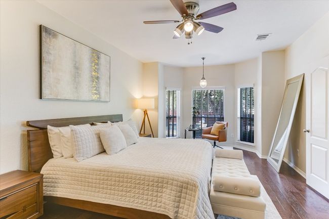 The main bedroom is located on the 1st floor. Plenty of room for your king size bed as well as a sitting area that overlooks the pool. | Image 11