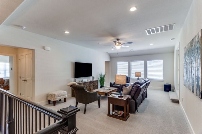 Living room featuring light carpet, ceiling fan, and recessed lighting | Image 25