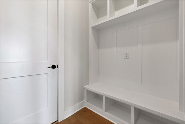 Mudroom with dark wood-type flooring | Image 36
