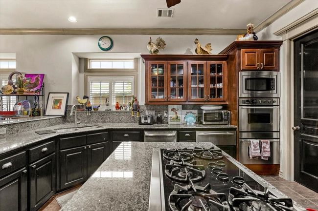 Solid black cabinetry and doors are just some of the things that help one to see that this home is very well built, and truly one of a kind. No surprise that the owner is a builder. | Image 13