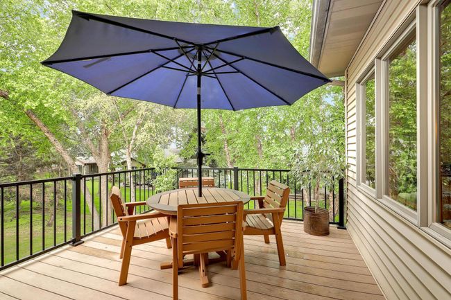 Upper level deck overlooking wooded yard. | Image 46