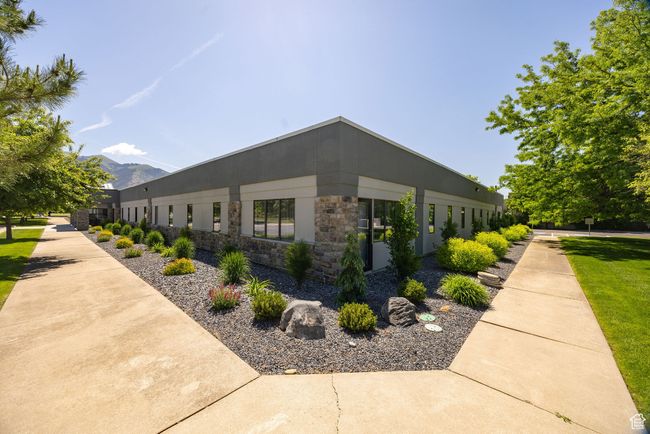 View of property exterior featuring stone siding and a mountain view | Image 27
