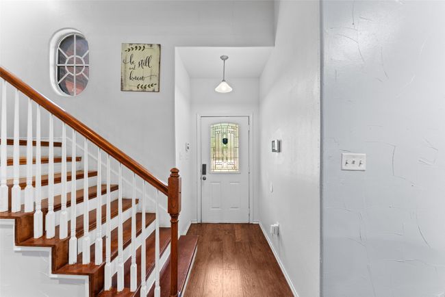 Entryway with dark wood-style flooring and stairs | Image 5