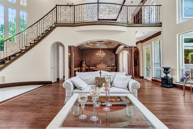 You can't help but be impressed by the wrought iron balusters going up the stairs and framing the game room above! | Image 8