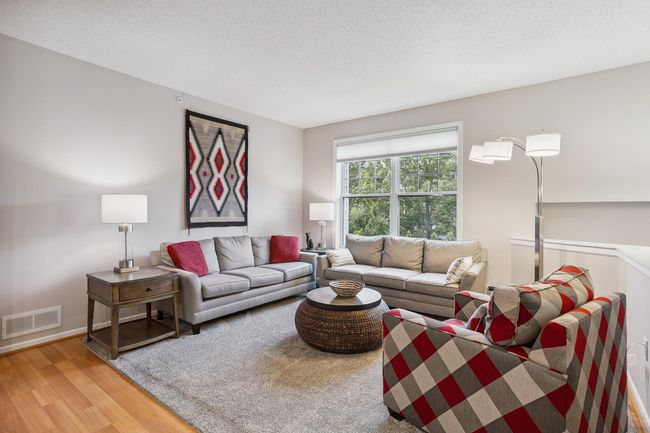 Second Floor Sun-Splashed Living Room featuring Hardwood Flooring | Image 5
