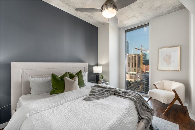 Bedroom with wood finished floors and a ceiling fan | Image 6