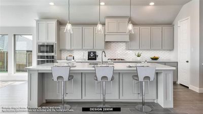 Kitchen featuring appliances with stainless steel finishes, an island with sink, and a healthy amount of sunlight | Image 2