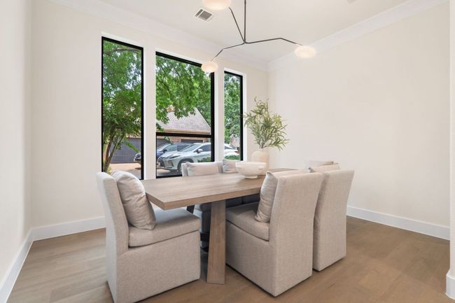The formal dining room sets the stage for memorable dinner parties and holiday gatherings, with elegant details and generous space for a large table. | Image 13