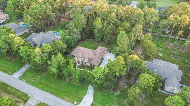 The sizable yard is ready for your creativity. | Image 8