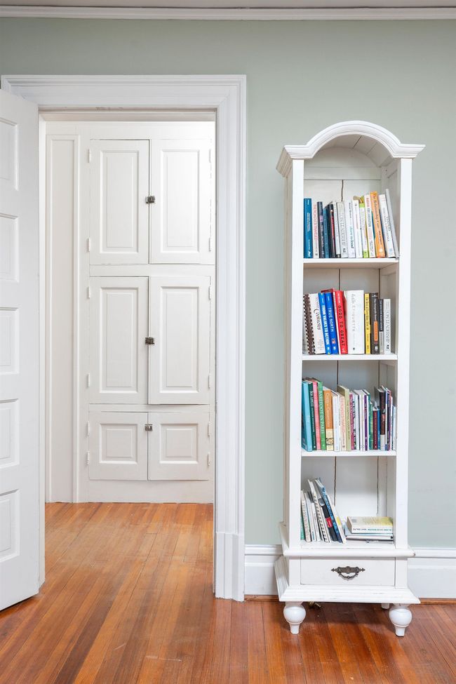 This linen closet is located in the hall leading to the primary bedroom and bath. | Image 43