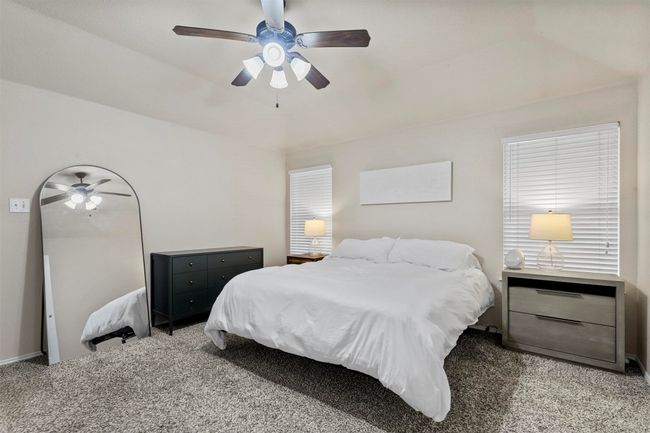 Carpeted bedroom with ceiling fan | Image 22